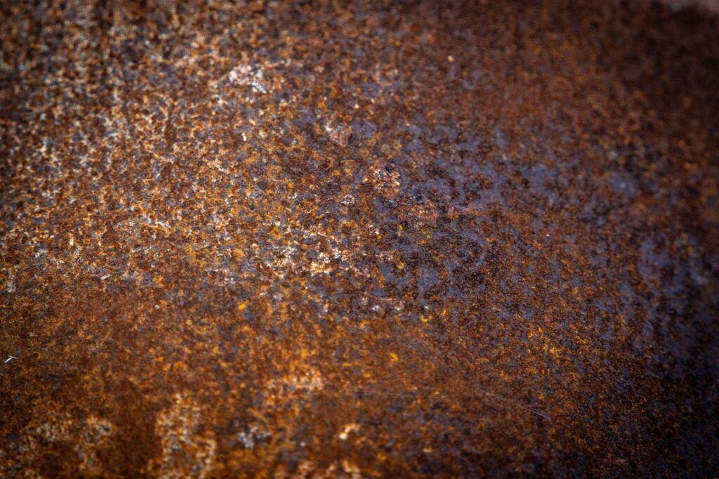 Detailed macro shot of rusty iron surface with rich texture.